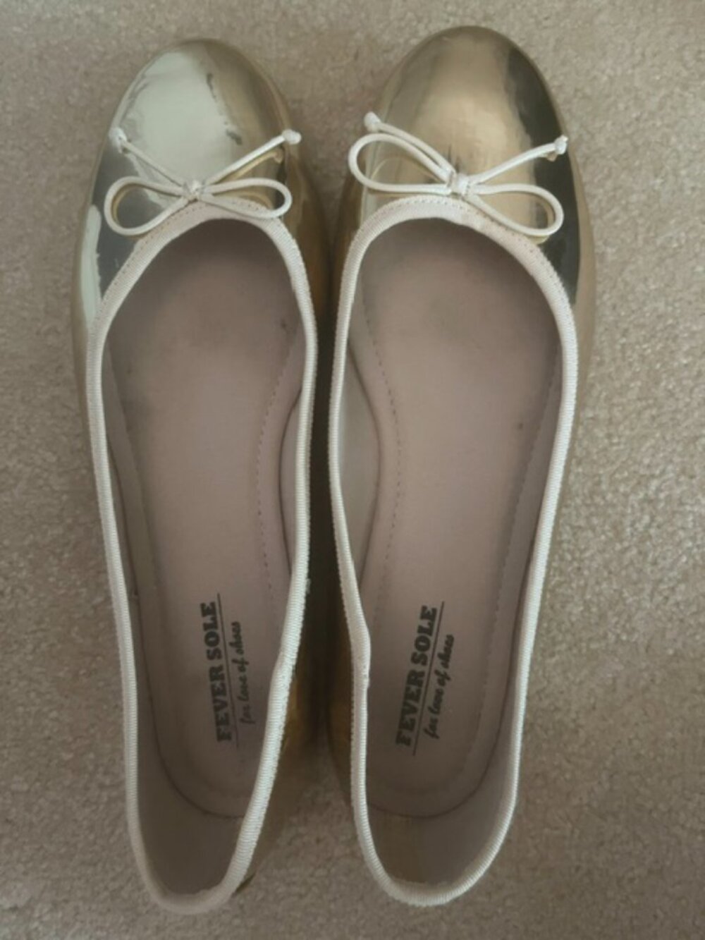 Fever Sole gold metallic ballet flats feature a bow detail